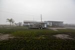 A destroyed camper sits in front of deteriorating trailers in Leeville, Louisiana, U.S., on Monday, December 18, 2017.   Louisiana is preparing recommendations through projects with LA Safe for emptying out coastal areas that are unprotected by levees and will be impacted by sea level rise in the coming years.