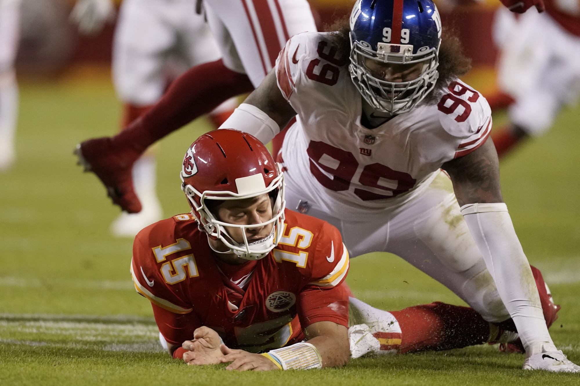 Kansas City Chiefs quarterback Patrick Mahomes (15) is tackled by