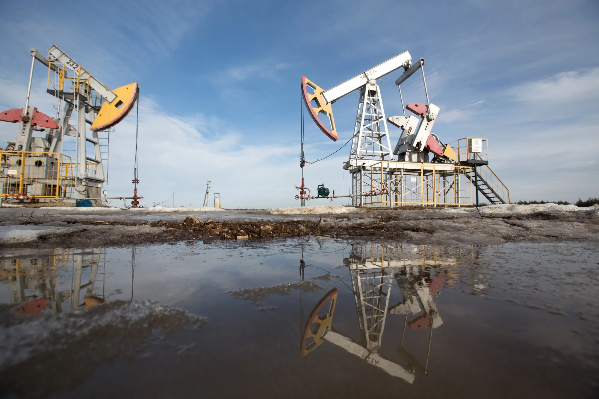 Oil pumping jacks stand in an oilfield near Almetyevsk, Tatarstan, Russia.