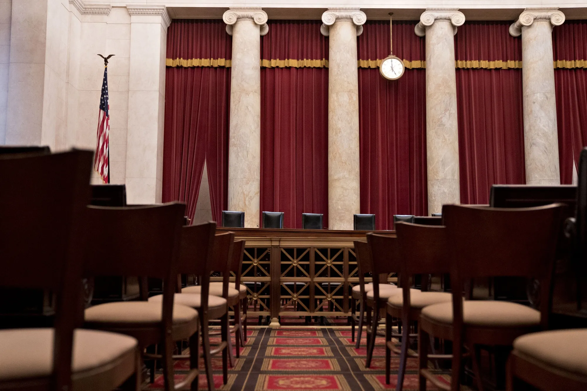 Chairs of US Supreme Court justices behind the courtroom bench in Washington.&nbsp;