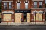 A pedestrian passes a boarded up store in Chicago, Illinois, U.S.