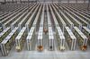 Employees push carts along aisles as they process customer orders ahead of shipping at one of Amazon.com Inc.'s fulfillment centers in Rugeley, U.K., on Monday, Dec. 2, 2013. Online retailers in the U.K. are anticipating their busiest day as shoppers flush with end-of-month pay-checks seek Christmas deals on the Web.