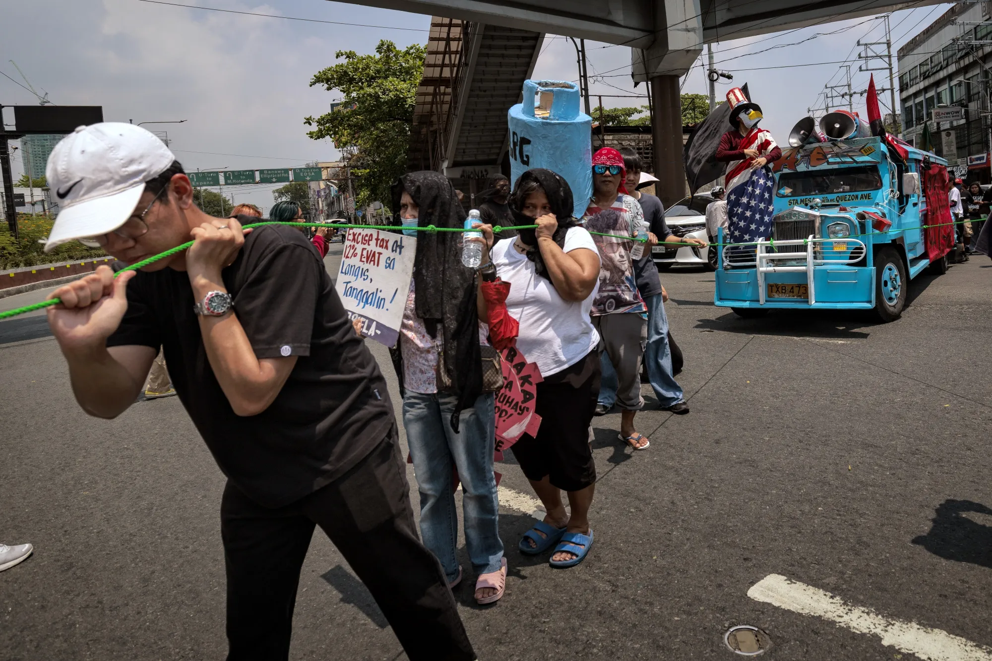 Transport workers and activists take part in a protest as they stage a strike over surging fuel costs in Manila on March 27.
