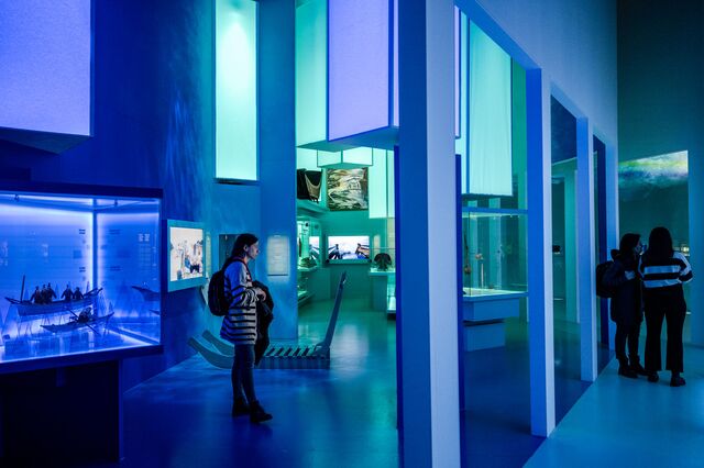 Blue light and visitors inside a museum