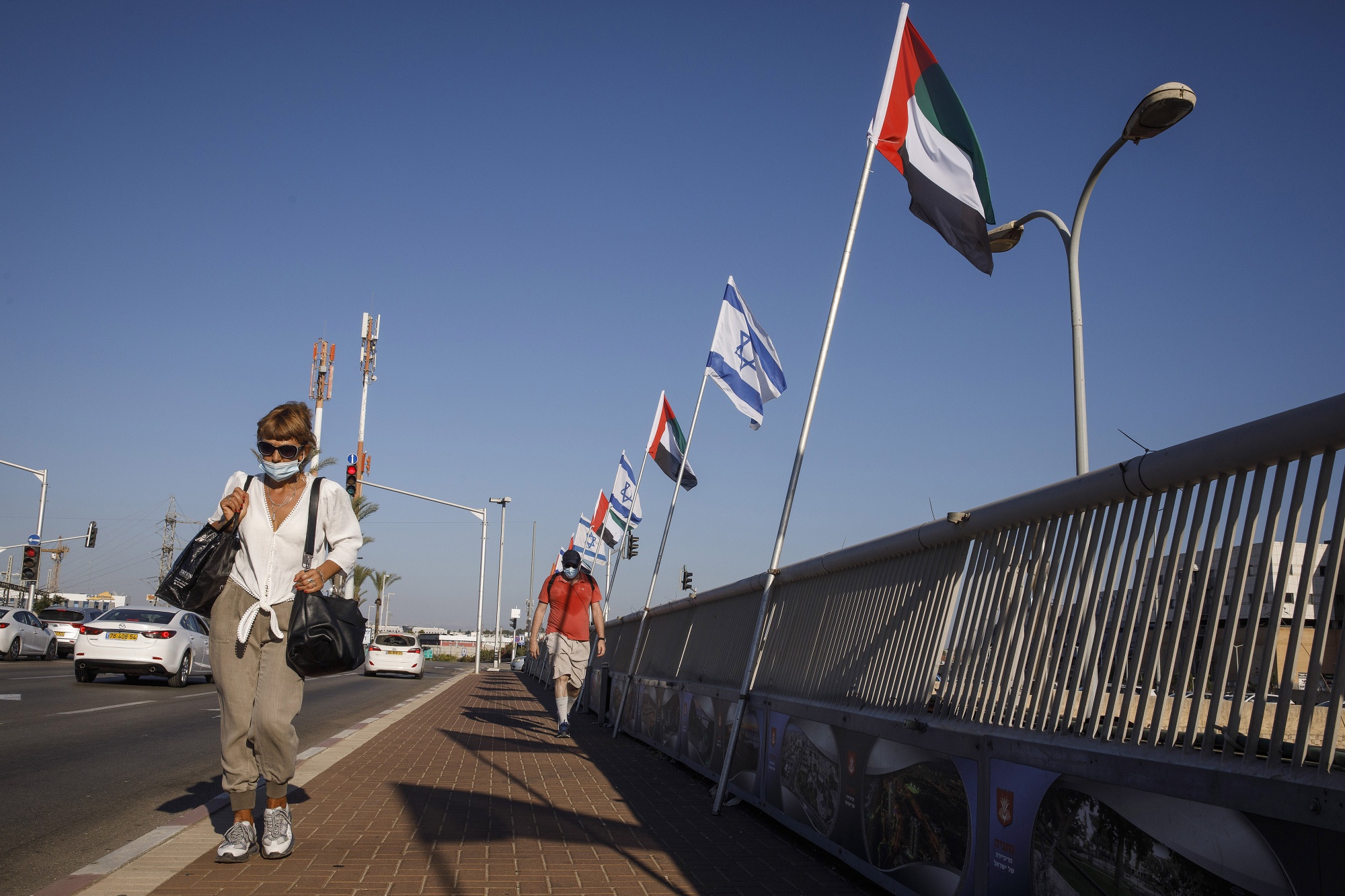 Israeli and UAE national flags fly in Netanya, Israel, on Aug. 17.