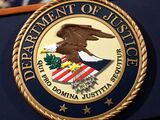 The US Department of Justice seal.