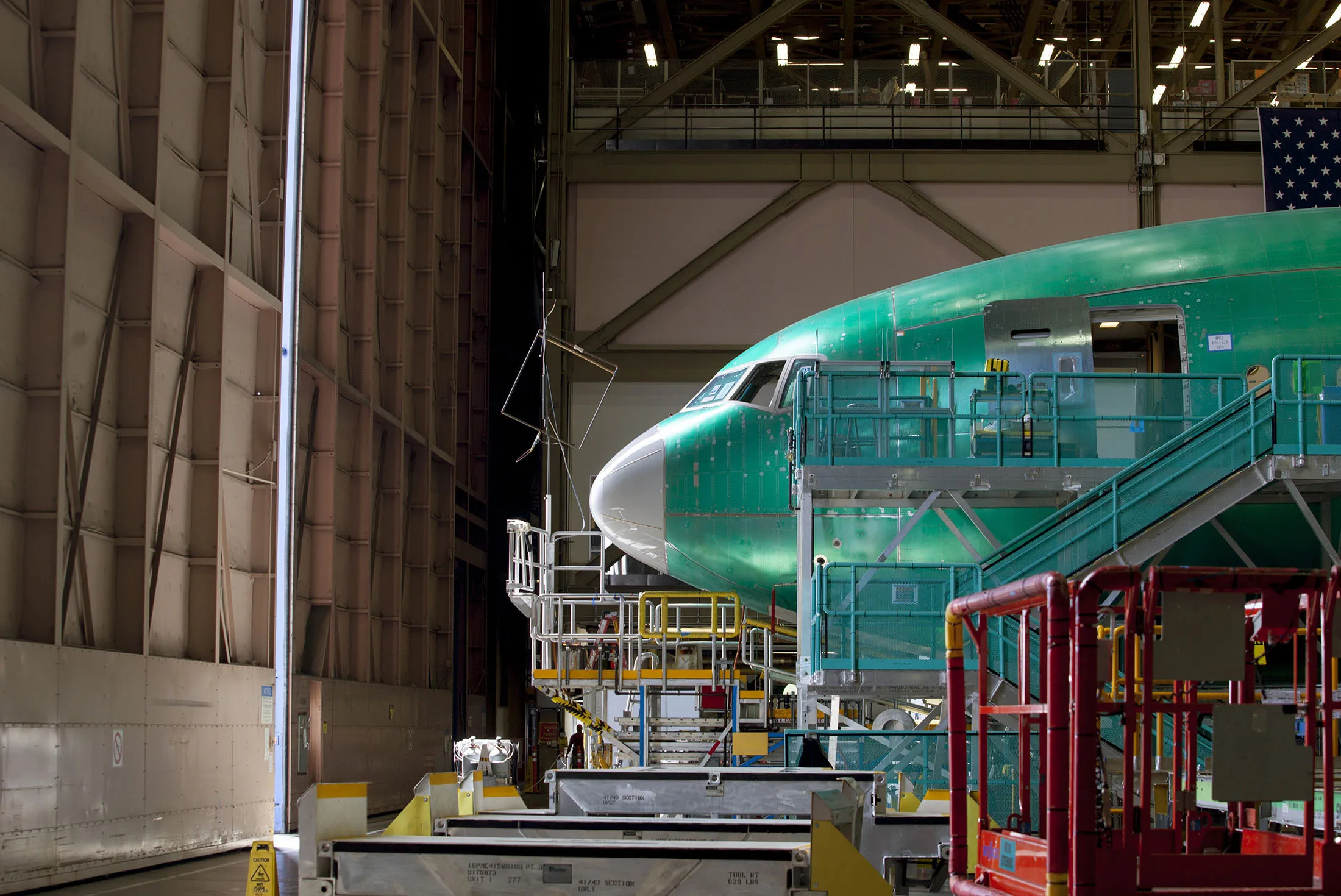 A nearly completed Boeing 777 reaches the end of a moving production line at the company's facility in Everett, Washington, U.S.
