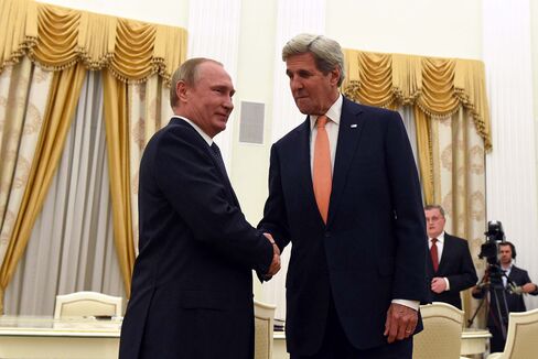 John Kerry, right, and Vladimir Putin on July 14.