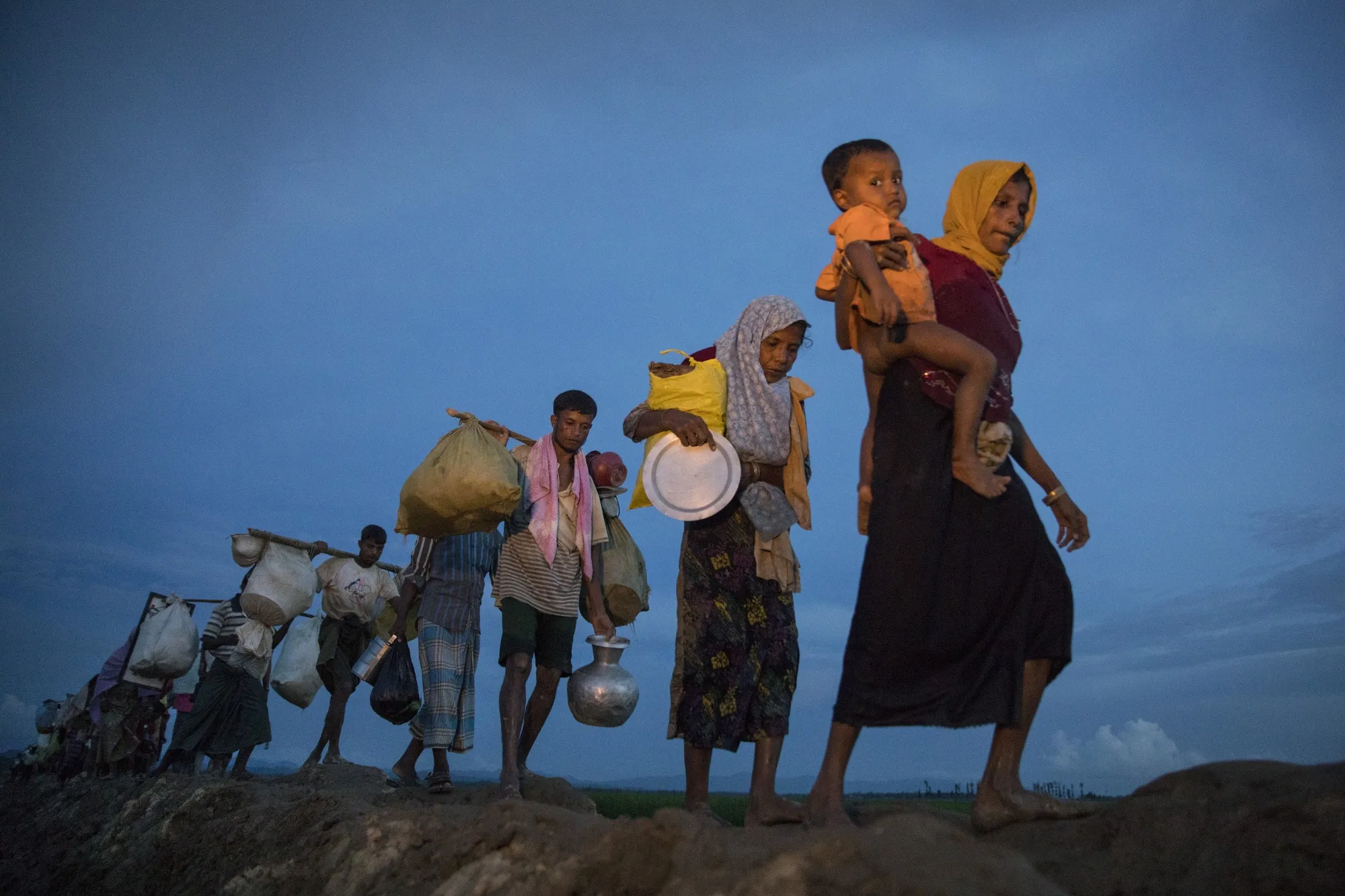 Rohingya refugees flee Myanmar and head towards Cox’s Bazar in Bangladesh, in Oct. 2017.