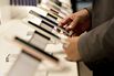A shopper looks over a display of Apple Inc. iPhones at a T-Mobile US Inc. store in Chicago, Illinois, U.S., on Friday, Oct. 21, 2016. T-Mobile US Inc. is scheduled to release earnings figures on October 24.