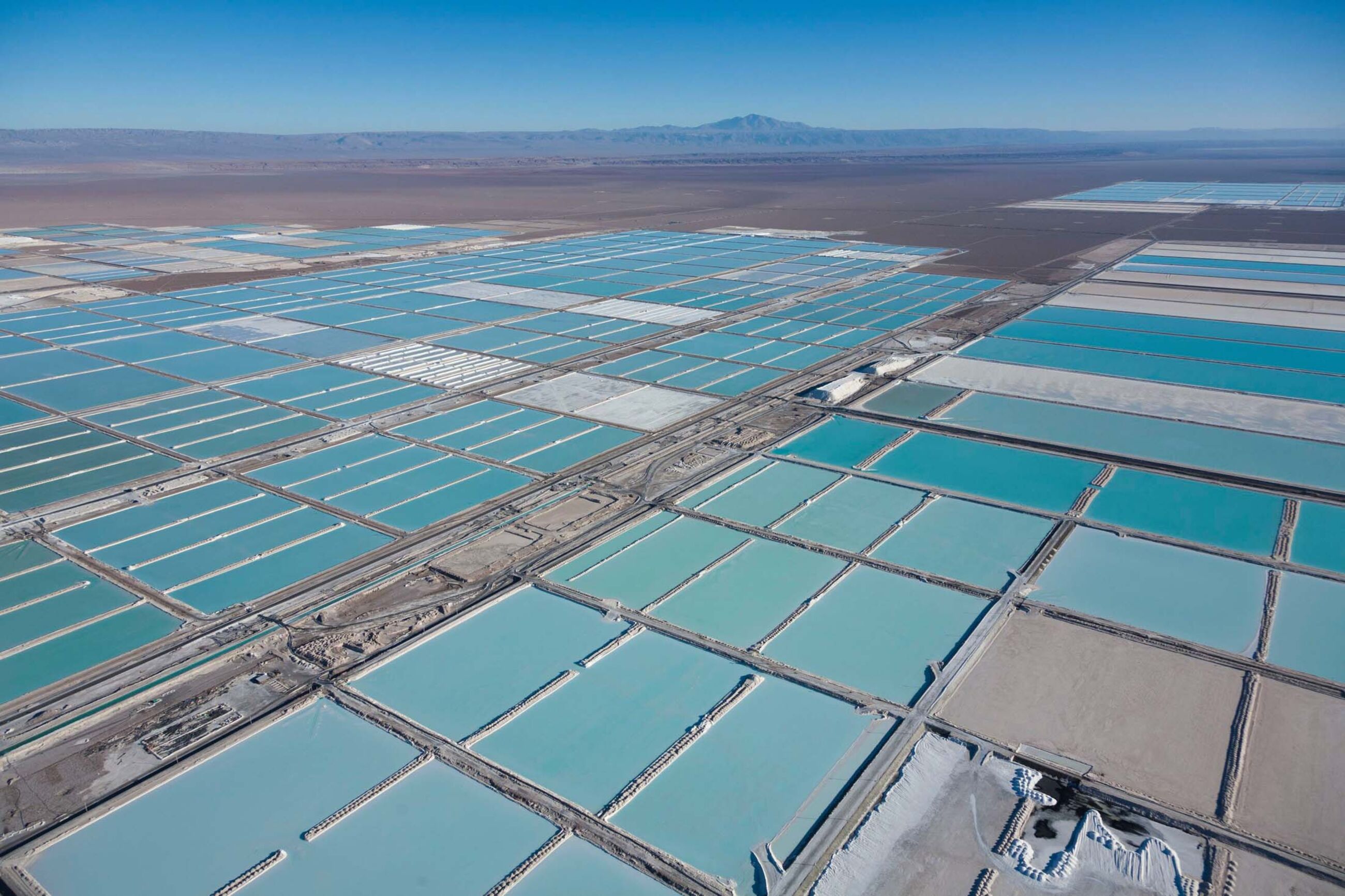 Chile, Antofagasta region, San Pedro de Atacama, Atacama salar, the world's largest lithium deposit, evaporation ponds of the Sociedad Quimica Mineral de Chile lithium mine or SQM and Sociedad Chilena del Litio or SCL (aerial view)