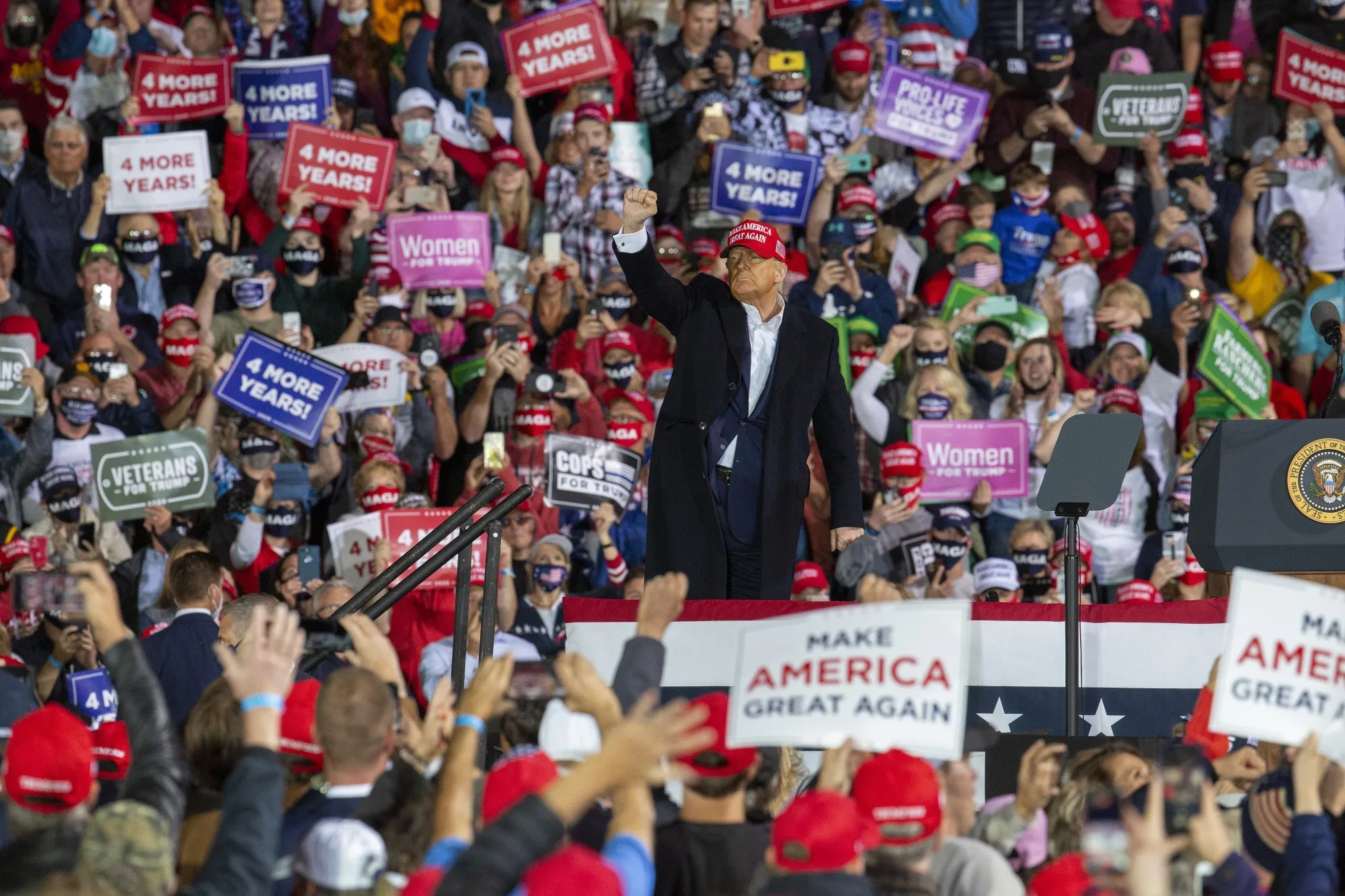 Donald Trump gestures during a campaign rally in Des Moines, Iowa, on&nbsp;Oct. 14.&nbsp;Trump touted Regeneron’s antibody cocktail as a&nbsp;cure&nbsp;and key to his recovery, saying he would make the drugs he took available for free to Americans.