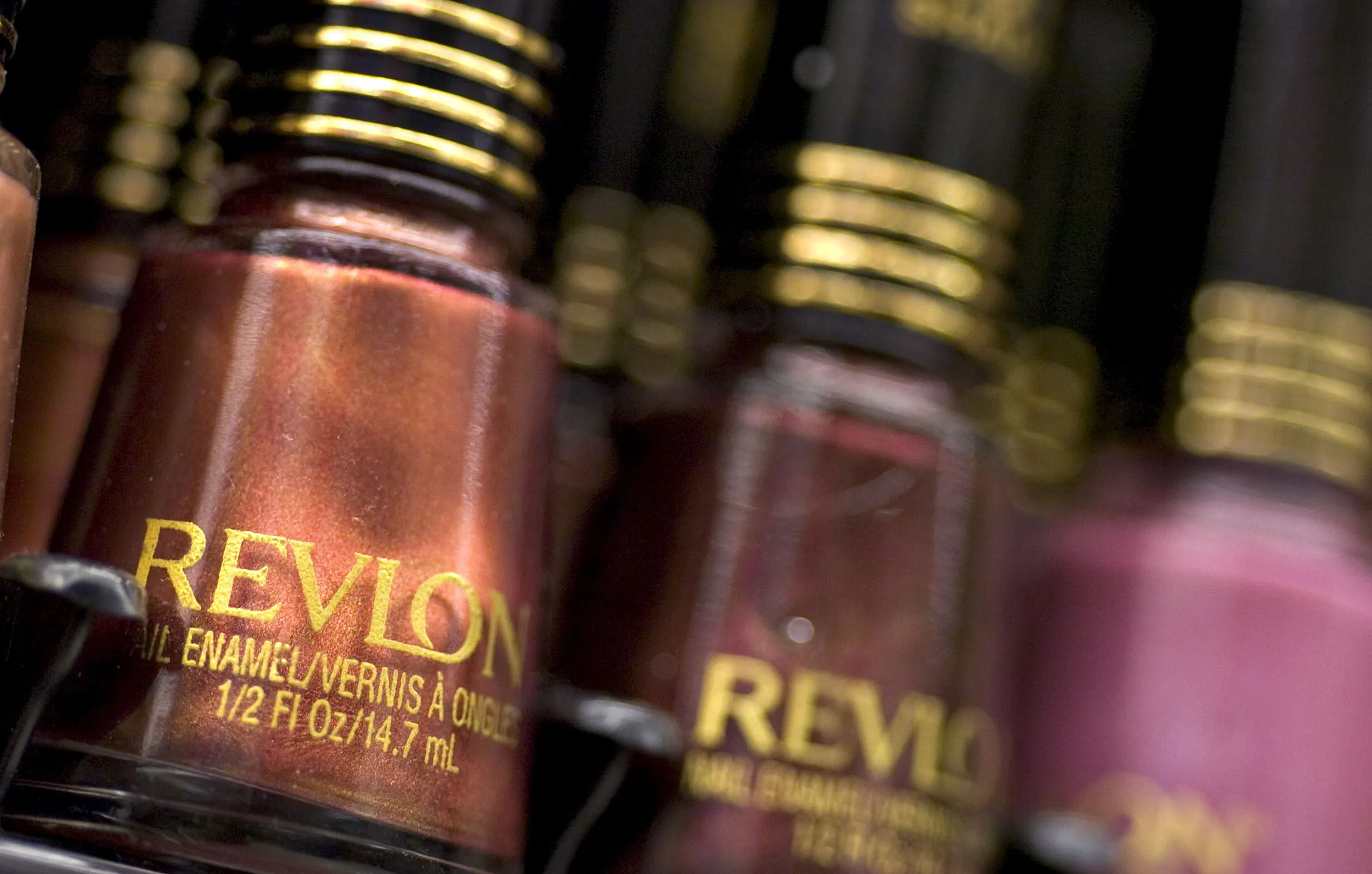 REVLON EARNS