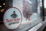 Foot Locker Inc. signage is displayed on the window of a store in downtown Chicago, Illinois, U.S., on Sunday, May 13, 2018. Foot Locker Inc. is scheduled to release earnings figures on May 25.