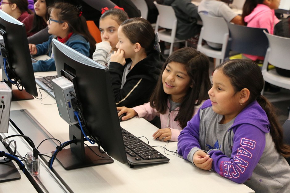 (Left to right) Mission's Gaby Moreno, Jacqueline Salazar, Larissa Leal, and Micaela Segundo learn to code using a Raspberry Pi.  