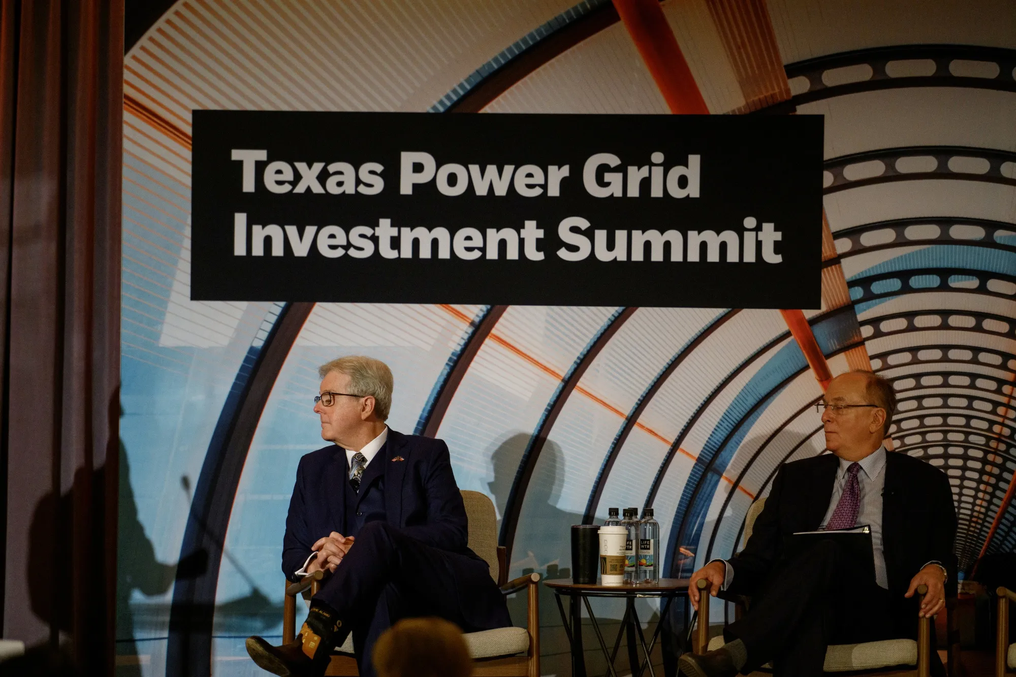 Dan Patrick, lieutenant governor of Texas, left, and Larry Fink, chairman and chief executive officer of BlackRock Inc., at the Texas Power Grid Investment Summit in Houston, Texas, US, on Tuesday, Feb. 6, 2024.
