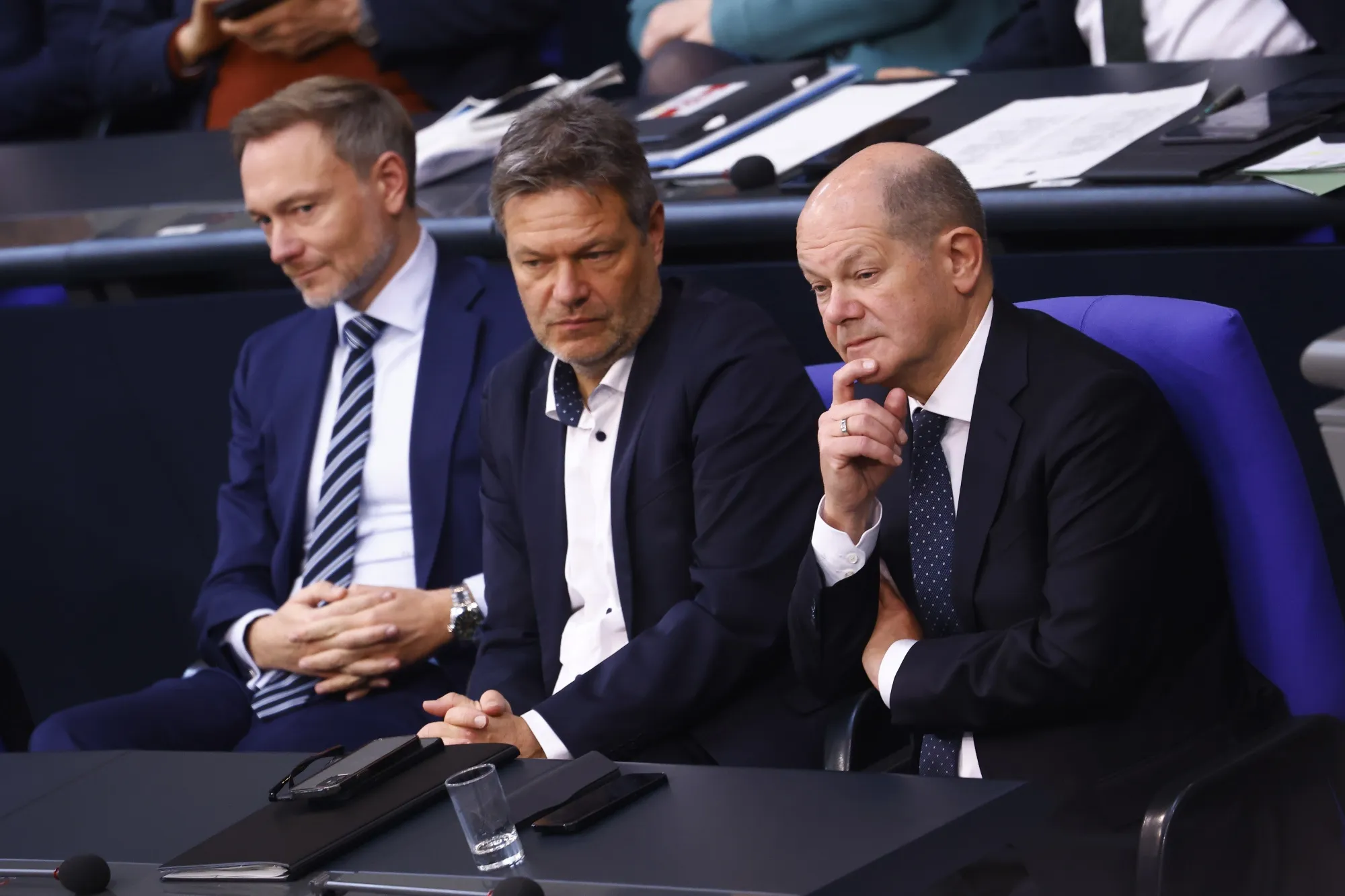 Olaf Scholz, right, Robert Habeck and Christian Lindner, left.