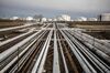 Oil transportation pipes and storage tanks stand in the Duna oil refinery, operated by MOL Hungarian Oil & Gas Plc, in Szazhalombatta, Hungary, on Monday, Feb. 13, 2019. Oil traded near a three-month high as output curbs by OPEC tightened global supply while trade talks between the U.S. and China lifted financial markets.