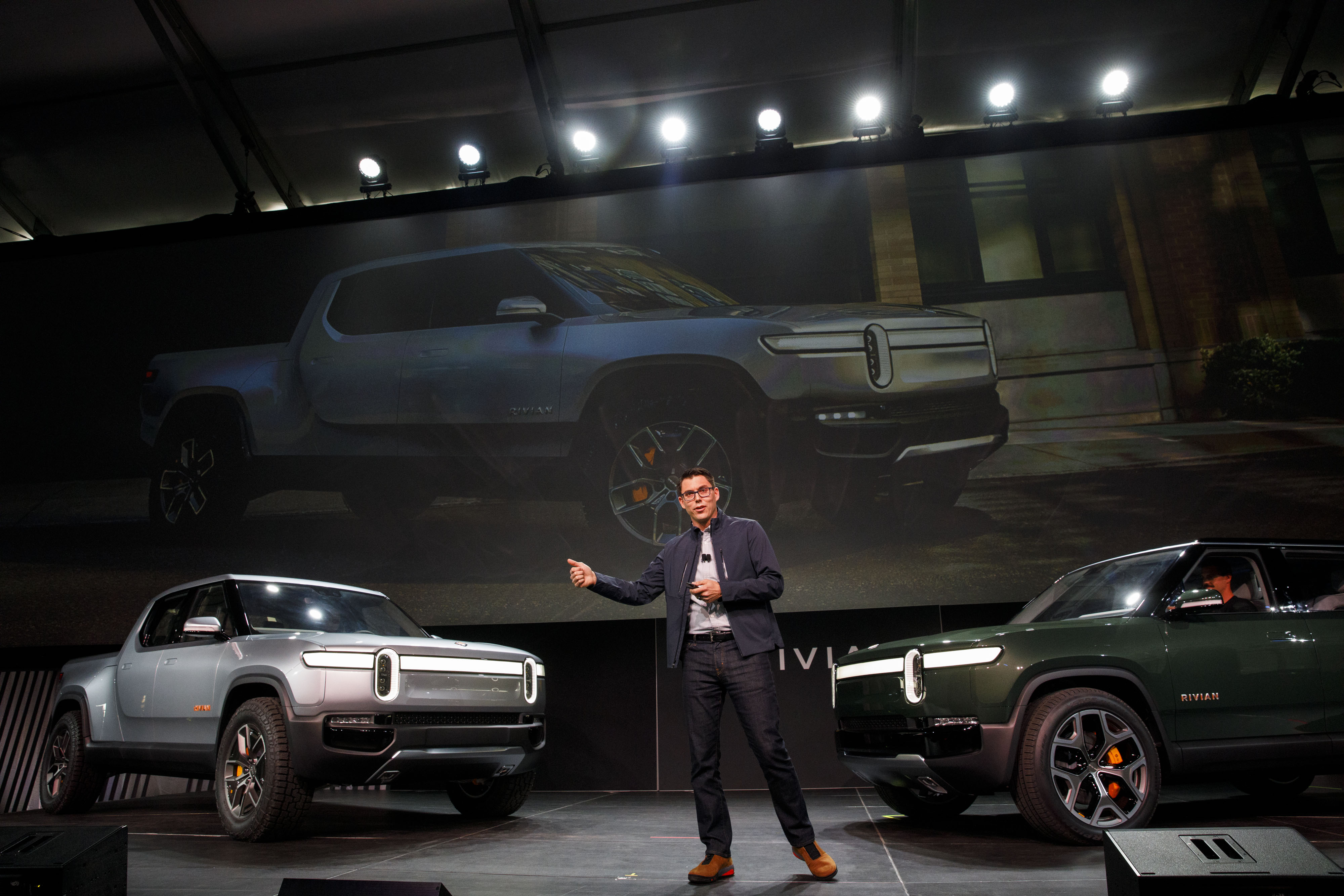 Scaringe unveiling the R1T, left, and R1S in 2018.