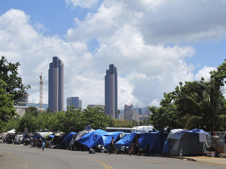 An encampment of homeless people in Honolulu, Hawaii. Once adjusted for housing and other costs of living, salaries in Honolulu rank lowest of all metros.
