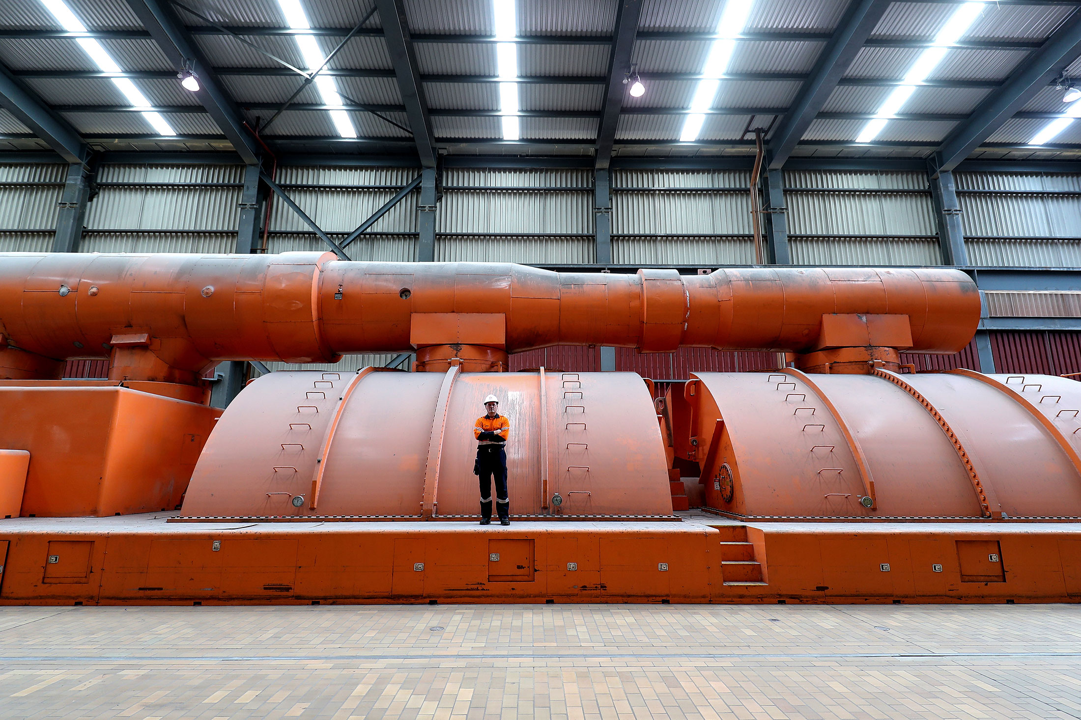 Group Manager Operations Eraring - Origin Energy, Tony Phillips poses for a portrait inside the turbine hall at Eraring Power Station, in Eraring, Australia, on Thursday, April 28, 2022.