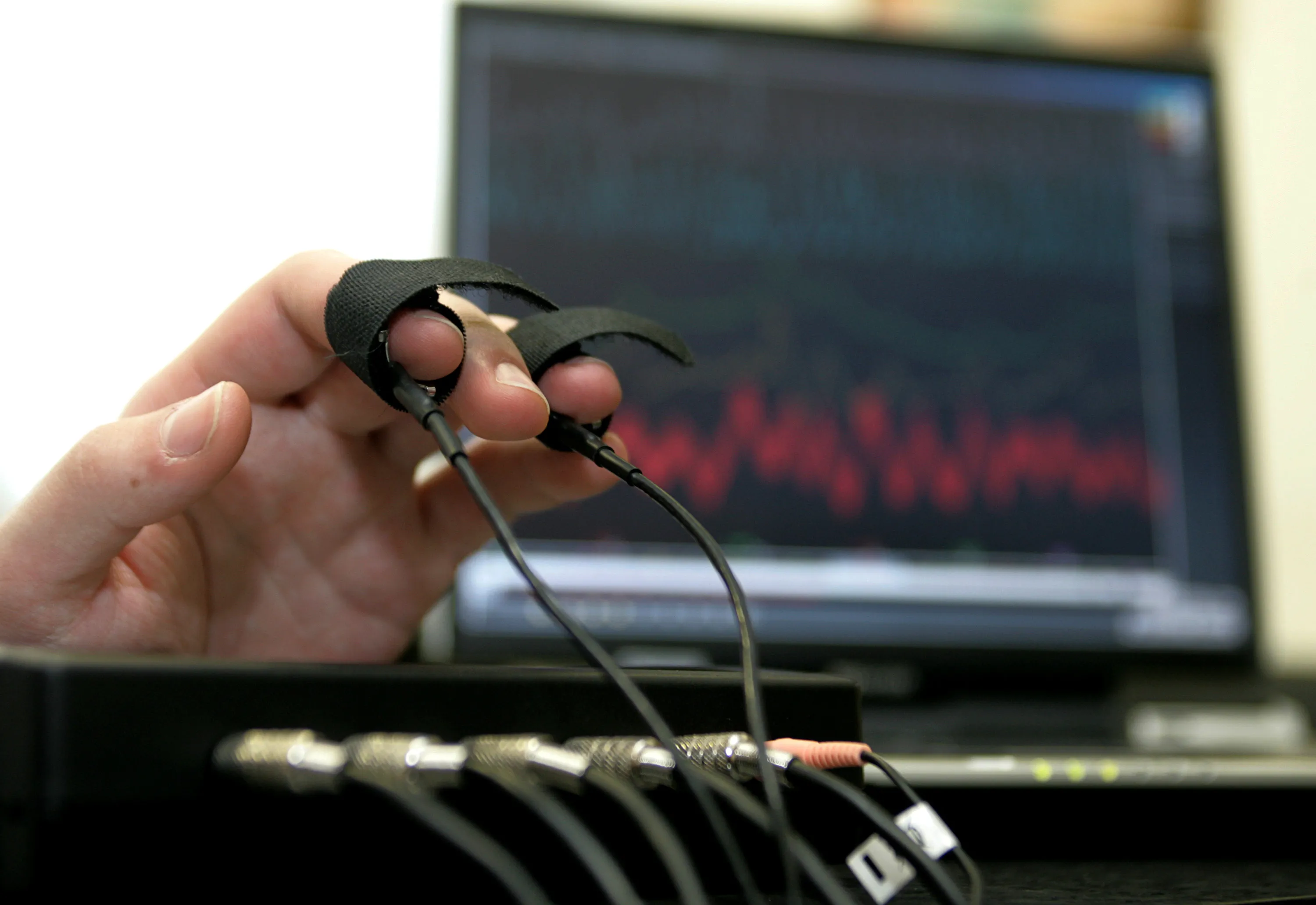 A computerized polygraph machine being used in a simulated situation.