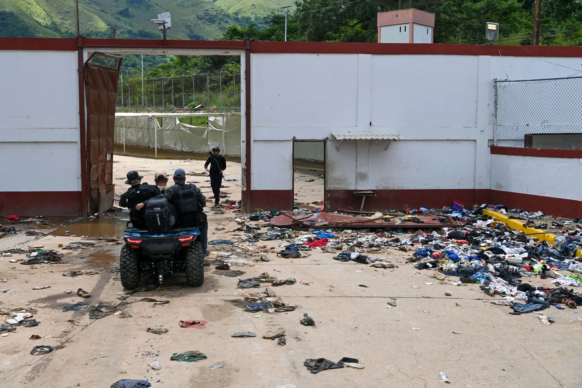 Members of the Bolivarian National Police patrol on a quad bike at the Tocoron prison following a mass escape by Tren de Aragua members in Tocoron, Venezuela in Sept. 2023.&nbsp;