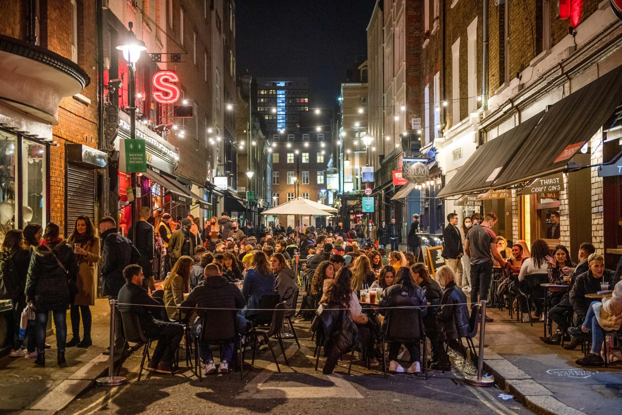 Pandemic programs that allowed outdoor dining on streets and sidewalks, like this packed street scene in Soho, often left little room for “non-normative” users.&nbsp;