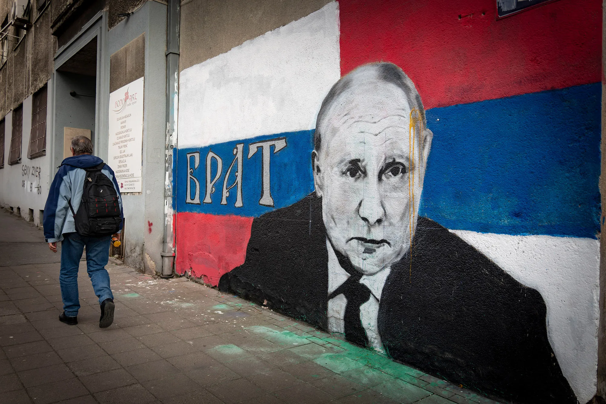 A street mural reading "Brother" depicts Vladimir Putin, in Belgrade, Serbia.