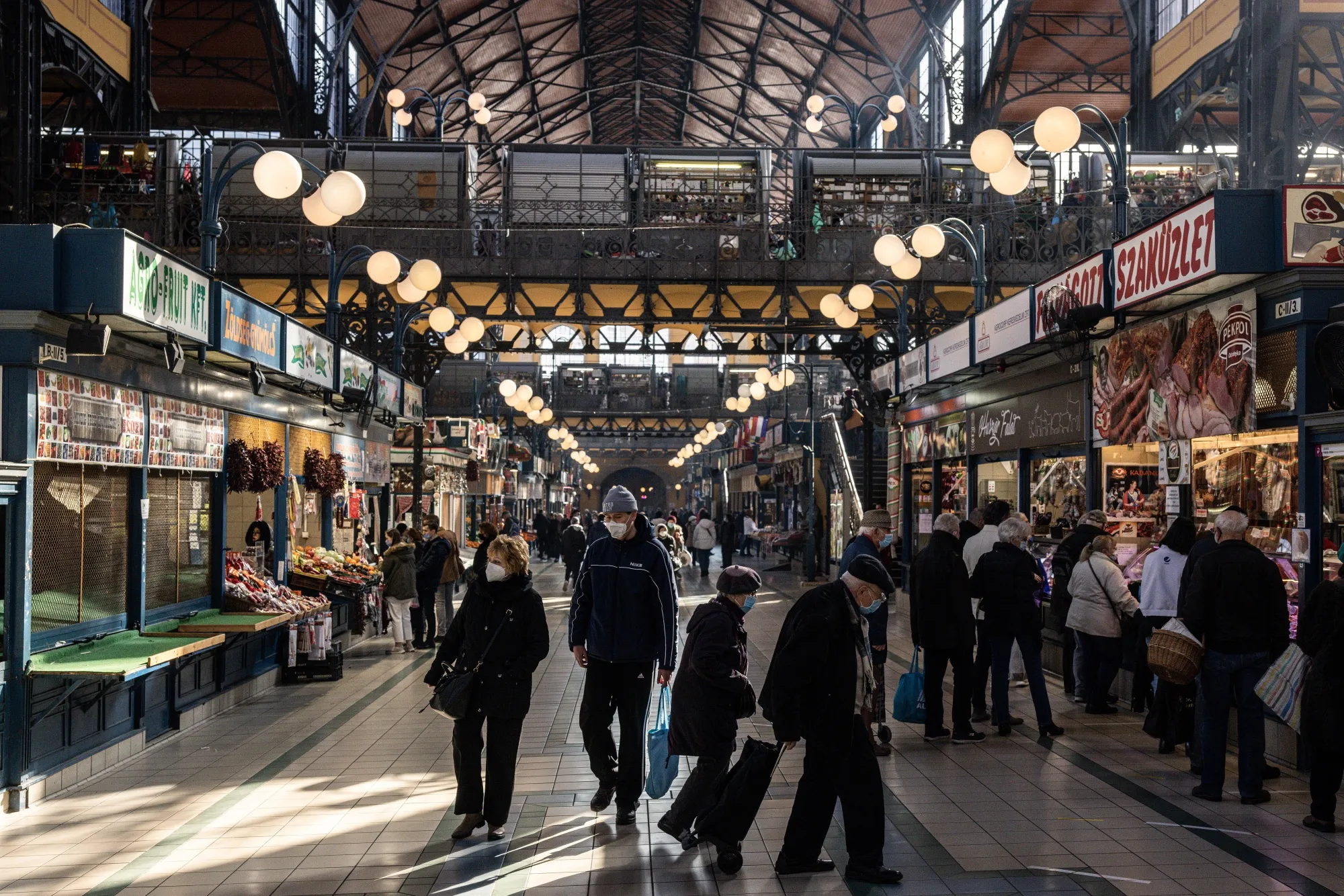 Shoppers wear protective face masks in the Grand market hall in Budapest, Hungary.