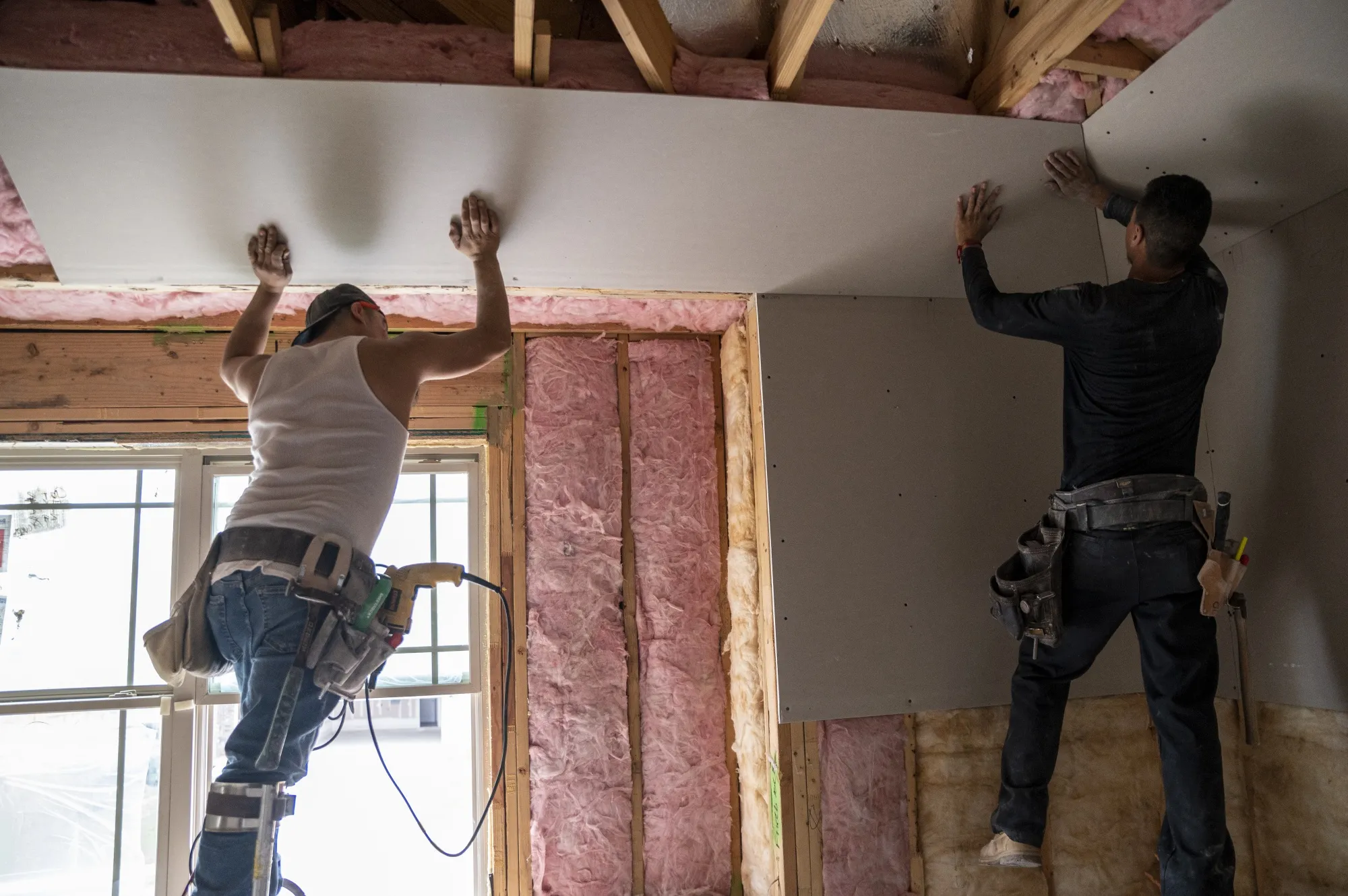 Workers cover insulation at a new home&nbsp;in Texas.&nbsp;