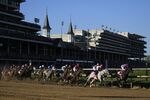 Horses round the first turn at Churchill Downs during the 147th Running of the Kentucky Derby in Louisville, Kentucky, on May 1, 2021.