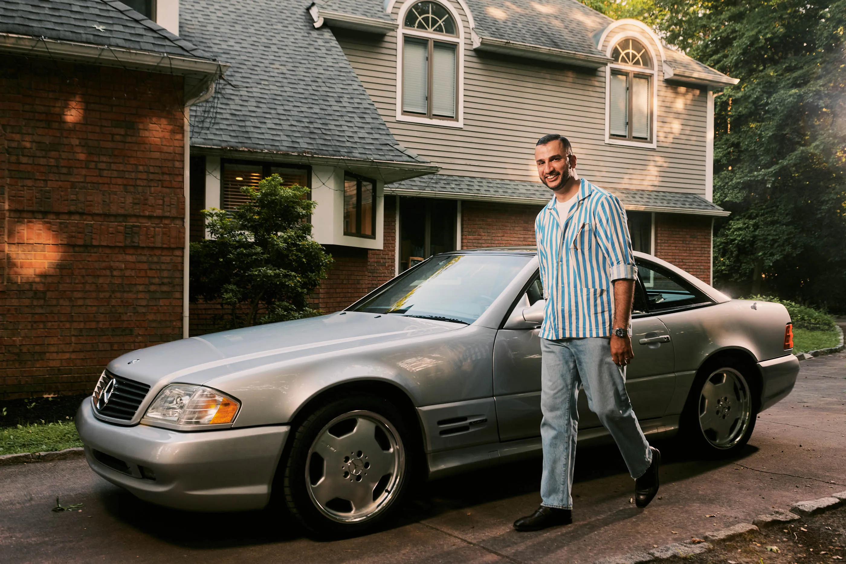 Por Homme founder and marketing consultant Atif Kazmi with his 2000 Mercedes-Benz SL 500 in Voorhees, New Jersey. “I felt like it was the perfect balance of being close to a classic but still fairly modern to drive,” he says. 