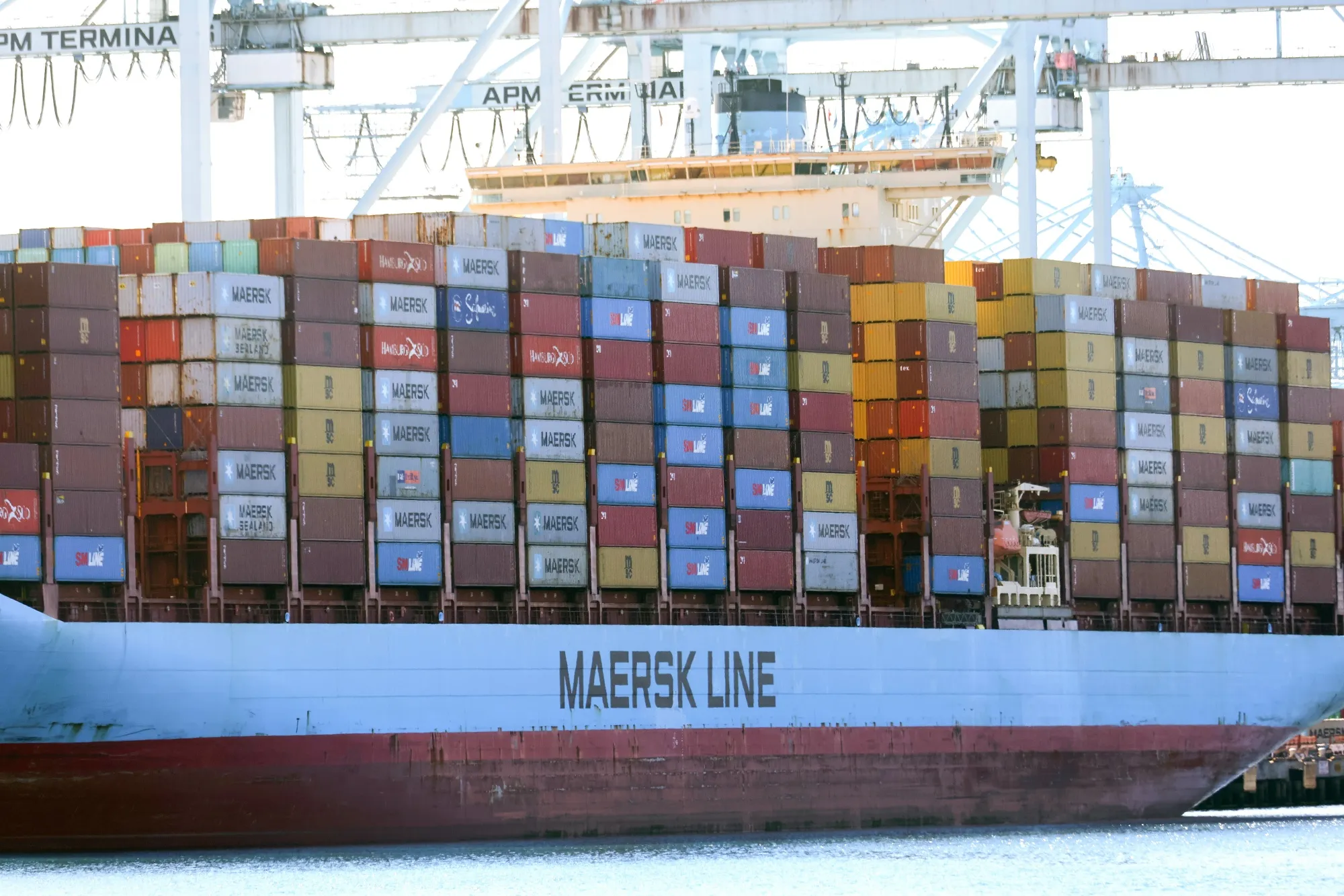 The number of ships&nbsp;waiting to unload outside the twin Ports of Los Angeles and Long Beach has been cut in half.