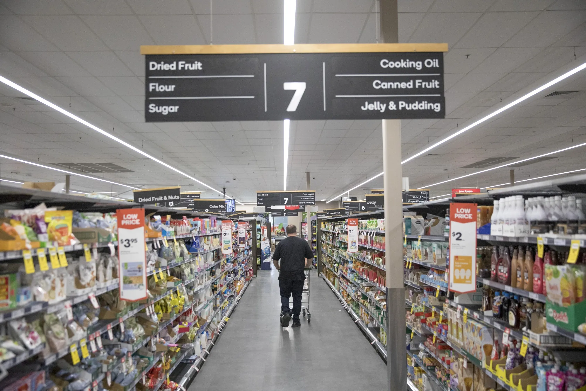 A man walks through an aisle at a Woolworths Group Ltd. grocery store in Sydney, Australia, on Monday, Aug. 21, 2023