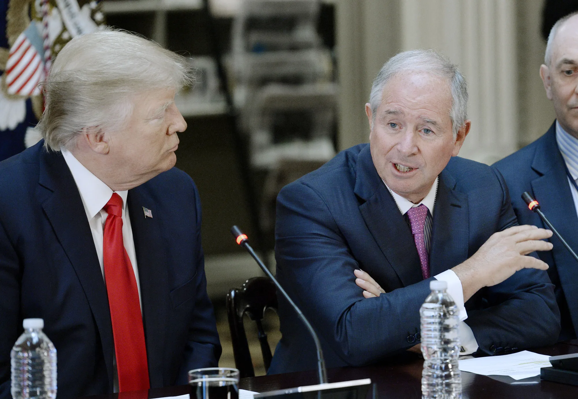 Stephen Schwarzman, right, speaks while Donald Trump listens Tuesday, April 11, 2017. 