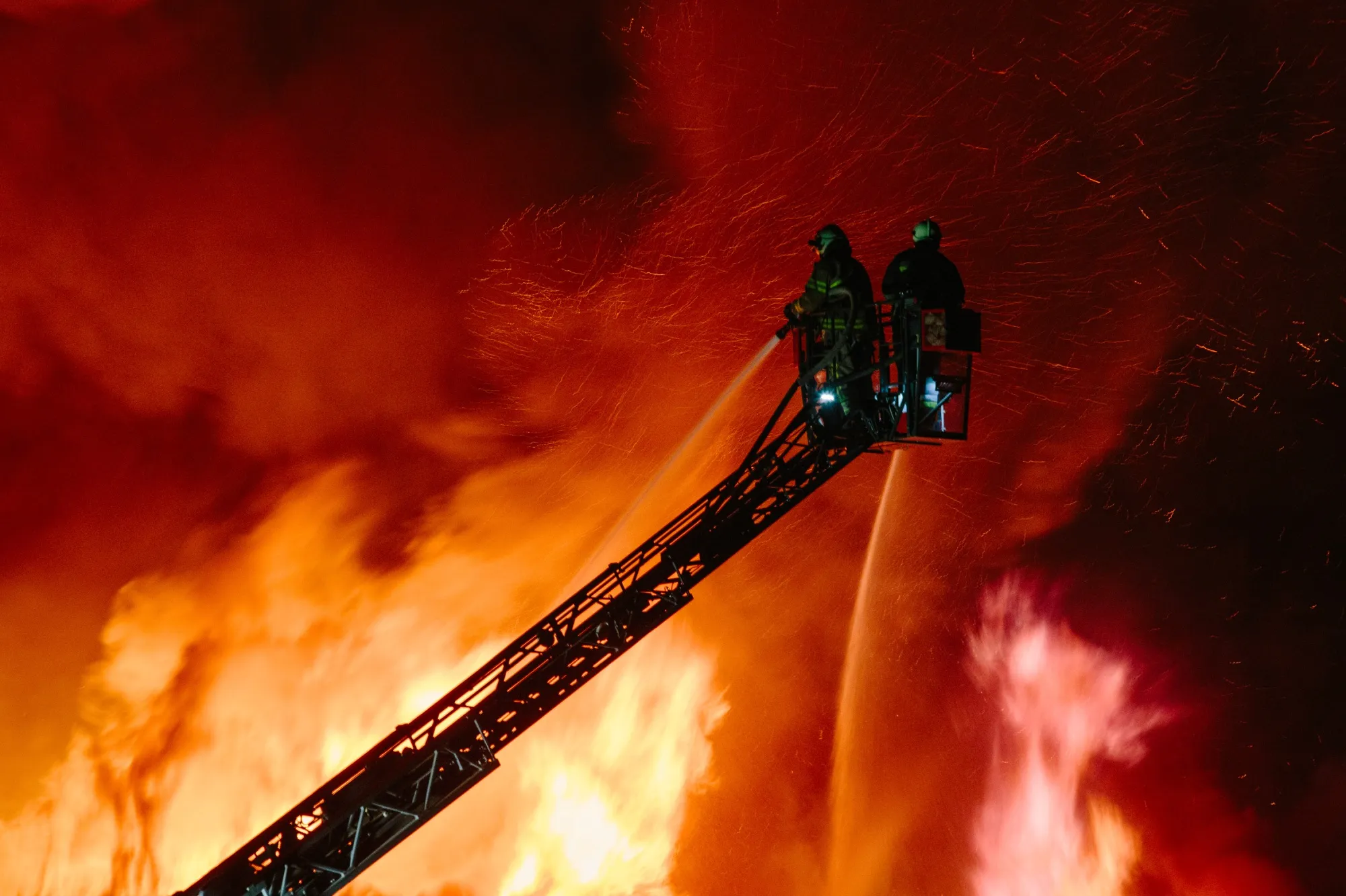Firefighters extinguishing the fire at the site of the drone attack in Kharkiv, on May 4.&nbsp;