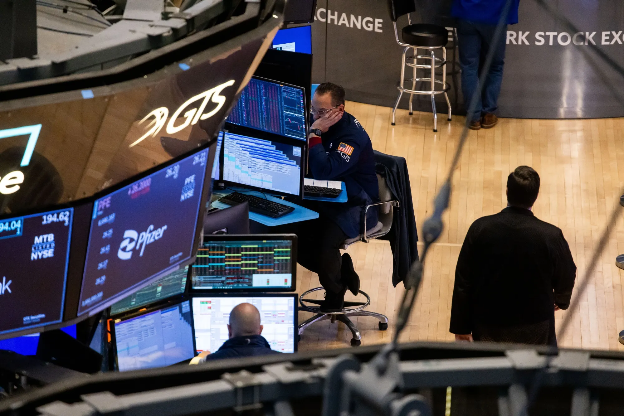 Traders work on the floor of the New York Stock Exchange.