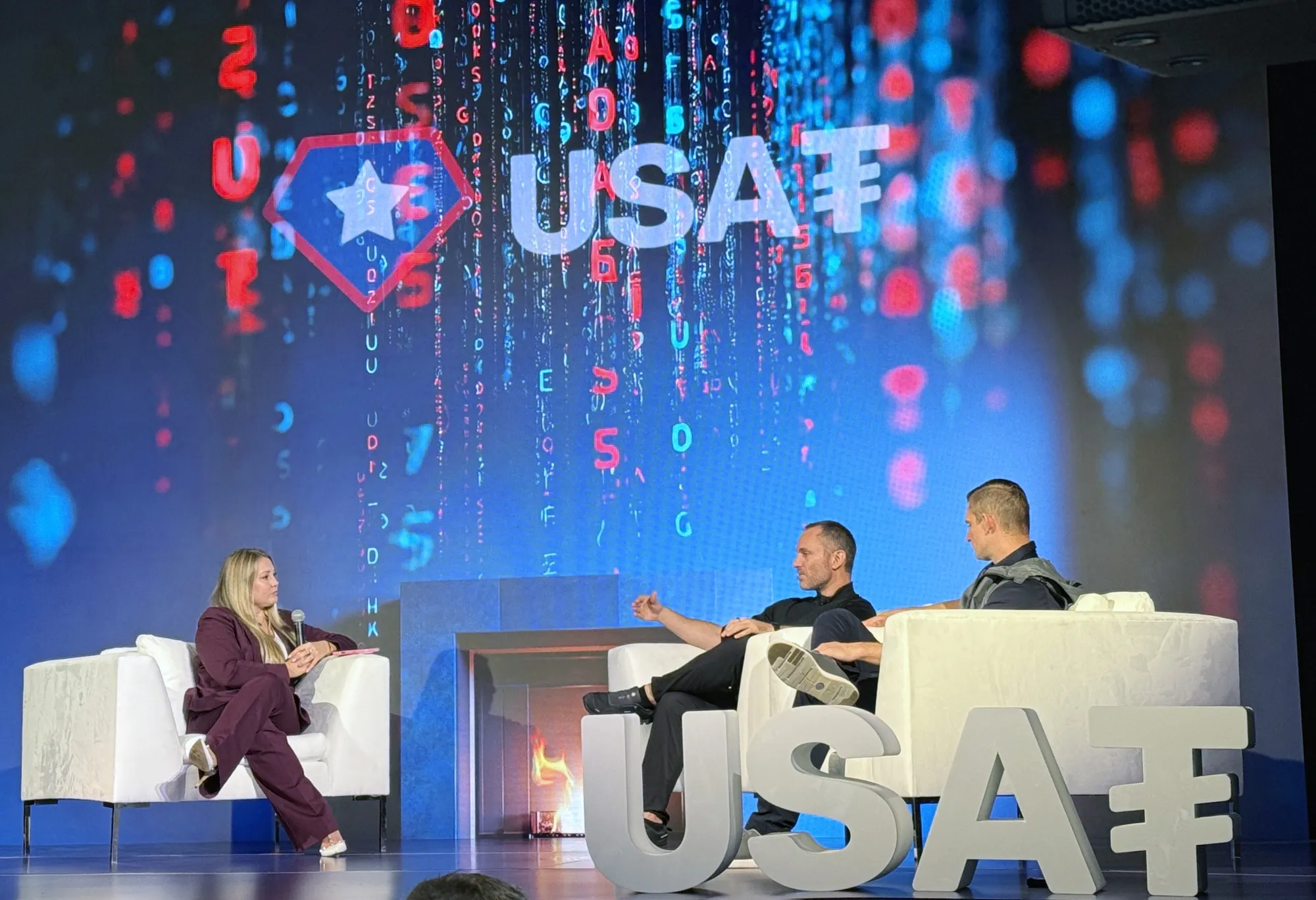 Tether Holdings CEO Paolo Ardoino, center, and Bo Hines, CEO of Tether USAT, right, announced plans to issue a US regulated, dollar-backed stablecoin during a press conference in New York on Sept. 12, 2025.