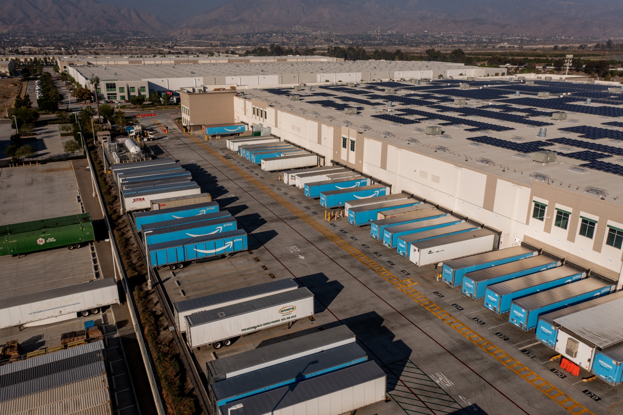 Amazon shipping containers outside a warehouse in Redlands, California.