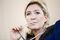 Marine Le Pen, leader of the French National Front, listens during a party debate in Paris, France, on Thursday, Oct. 20, 2016. Once seen as fringe groups, France's National Front, Italy's Five Star Movement, and the Freedom Party in the Netherlands have attracted legions of followers by tapping discontent over immigration, terrorism, and feeble economic performance. Photographer: Marlene Awaad/Bloomberg