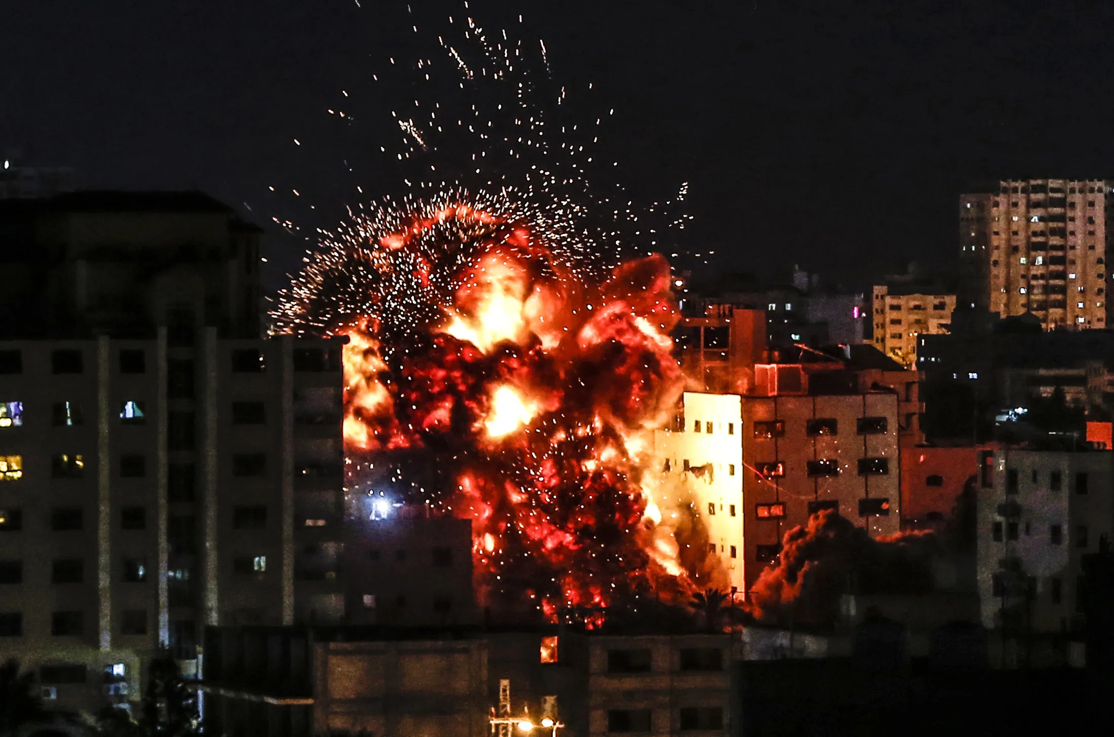 An explosion is pictured among buildings during an Israeli airstrike on Gaza City on May 4.&nbsp;