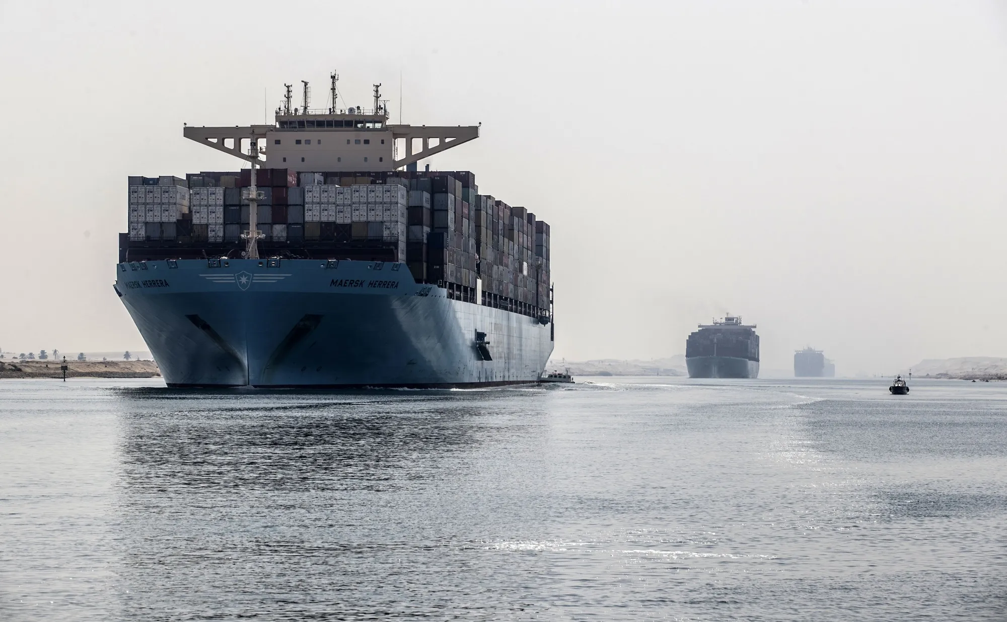 Container ships sail&nbsp;through&nbsp;the Suez Canal.