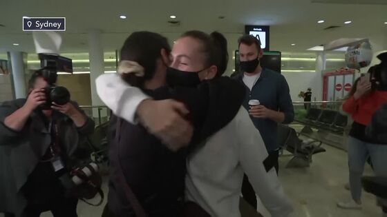 Teary Reunions in Sydney as Controversial Border Control Eases