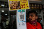 A juice stall advertises the use of the Paytm digital payment system in Mumbai.