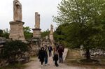 People visit the Temple of Hephaestus in Athens, on April 18.