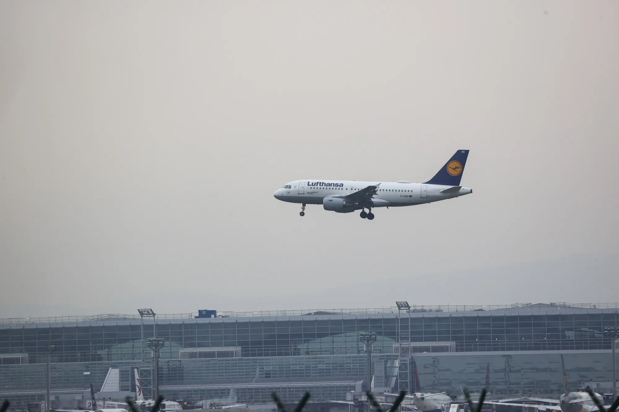 A passenger aircraft, operated by Deutsche Lufthansa AG, flies over Frankfurt Airport in Frankfurt, Germany.
