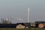 A wind turbine&nbsp;near PGE’s Belchatow coal powered power plant,&nbsp;in Rusiec, Poland.