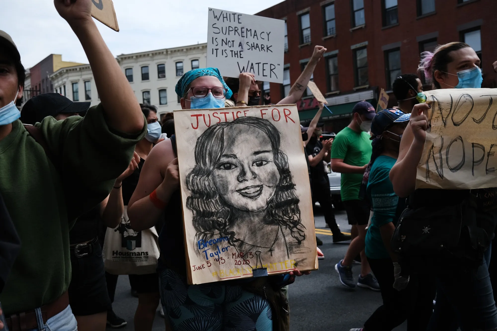 A protester holds a picture of Breonna Taylor during a demonstration in New York City on June 5.