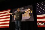 John Fetterman arrives on stage during a campaign rally in Erie, Penn.,&nbsp;on&nbsp;Aug. 12.